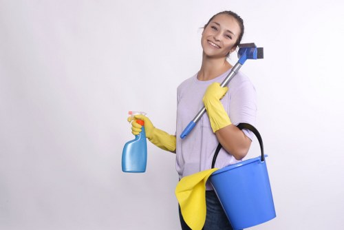Cleaner wearing PPE while inspecting carpet cleaning equipment
