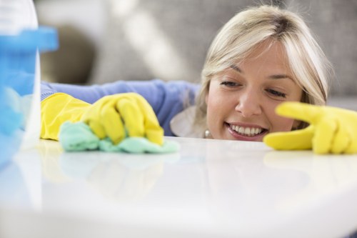 Technician handling reusable cleaning supplies and sorted recyclable packaging